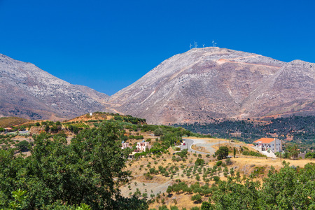 Typical Cretan landscape  hills, olives and wind-power usage の写真素材