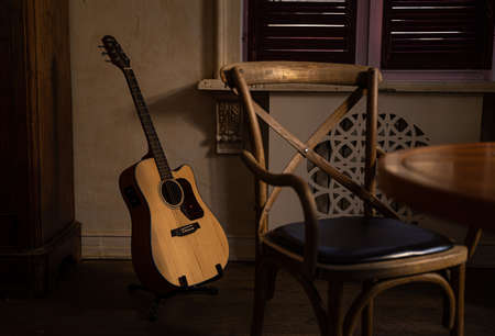 guitar in interior and chairの写真素材