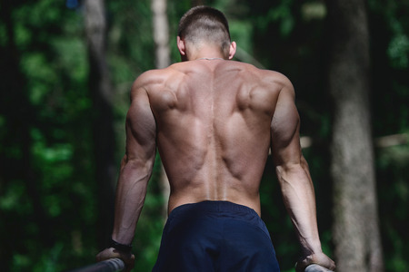 Fitness strength training workout bodybuilding concept background - muscular bodybuilder handsome...