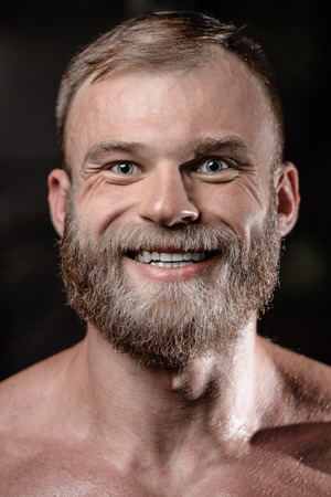 brutal muscular man with beard train in the gym unshaven fitness model healthcare lifestyle with topless body strong absの写真素材