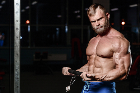 brutal muscular man with beard train in the gym unshaven fitness model healthcare lifestyle with topless body strong absの写真素材