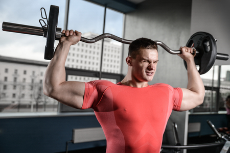 young man train in the gym healthcare lifestyle sexy caucasian man bodybuilder work out naked body torsoの写真素材