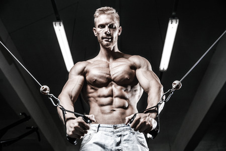 Brutal caucasian handsome fitness men on diet training chest pumping up body