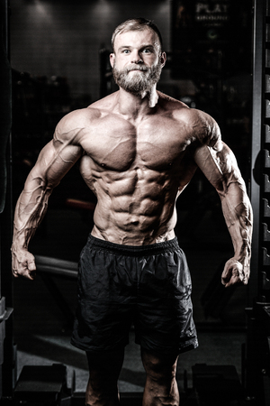 Sexy portrait of a very muscular shirtless male model looking awayの写真素材