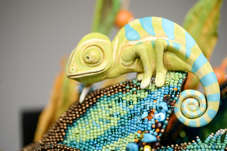 Porcelain paper mache clay chameleon colourful reptile beads mosaic beauty handmade handcrafted toy craft vintage flowers decor doll gift texture conceptの写真素材