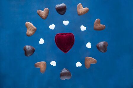 Floating flying heart shaped cookies light bright background isolated gluten-free caramel ginger...