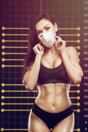 Fitness woman with coronavirus disease COVID-19 infection medical illustration muscles workout. Pretty caucasian fitness girl and bodybuilding concept gym abs, arms, back, chest exercisesの写真素材