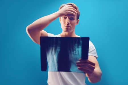 patient examines the x-ray and mri in the office. Health care conceptの写真素材