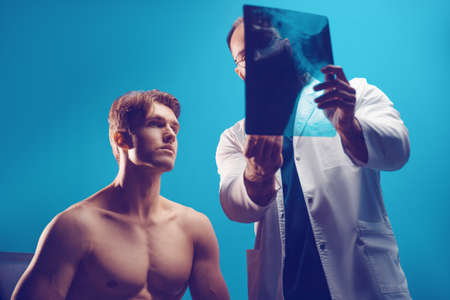 Doctor examines information and writes a prescription online with modern technologyの写真素材