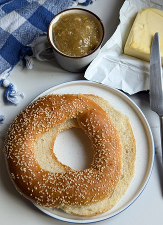 Bagel with butter for breakfast time image