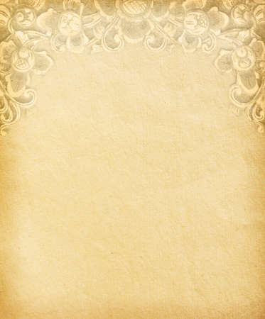 Old worn paper with decorative ornamentの写真素材