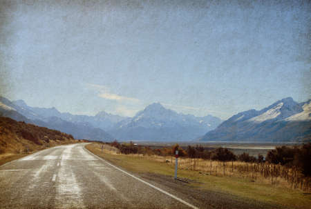 Road of the mountains in retro style  Paper texture  Road to Mount Cook National Park, New Zealand