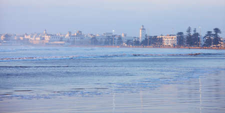 Essaouira , Morocco.  City and Wilaya  in  mist  at sunset., view from the beachの写真素材