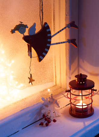 Christmas decoration in night on old window. Selective focusの写真素材