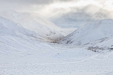 View of the Crown Range mountains  after snowfall.の写真素材
