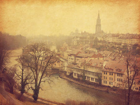 View on old town of Bern and river Aare. Photo in retro style. Added paper texture. Toned imageの写真素材