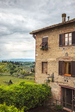 Old house with a view of the surroundings San Gimignano, Italyの写真素材