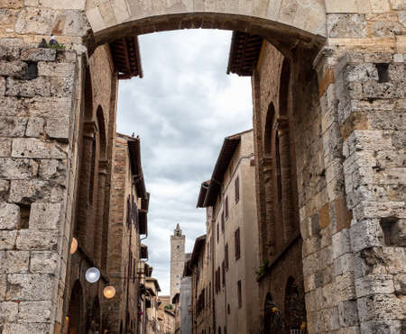 View from the arch at the entrance to the  San Gimignano, Italyの写真素材