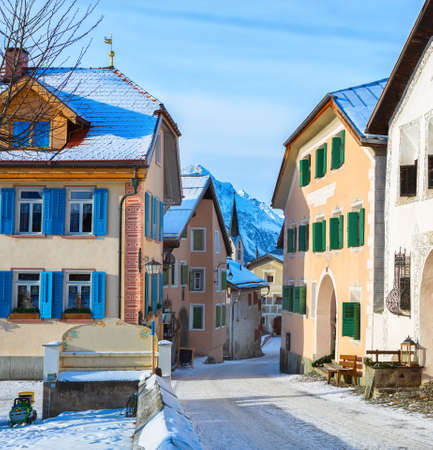 Narrow street with  typical houses  in the older part of Guarda at sunny winter morning,  Inn...