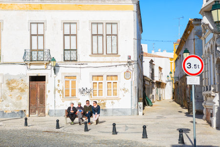 Faro, Algarve, Portugal -  April 29, 2018:  Ð¢ourists, relaxing in historic old town Faro.のeditorial素材