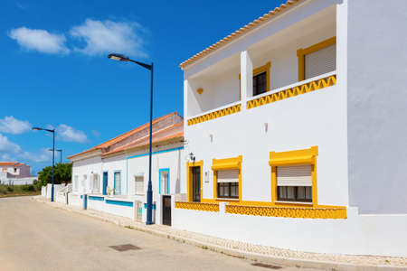 Street with typical  Portuguese white houses in Sagres,  the municipality of Vila do Bispo,  southern Algarve of Portugal.の写真素材