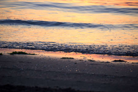 Sea Sunrise with Clouds and Wavesの写真素材