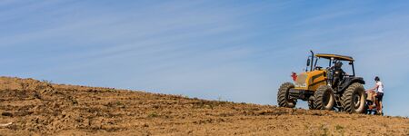 planting corn on a small farmの写真素材