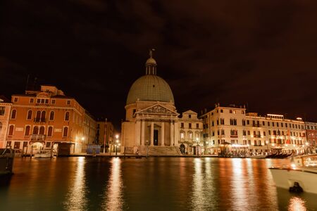 Venice canals, characteristic view of the island, at night, horizontal orientationの写真素材