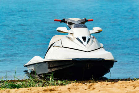Jet ski parked by the lakeの写真素材