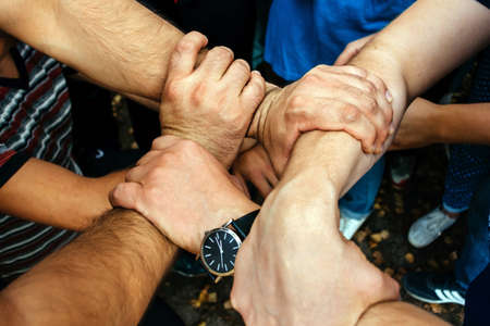 Hands are woven together in a team gameの写真素材