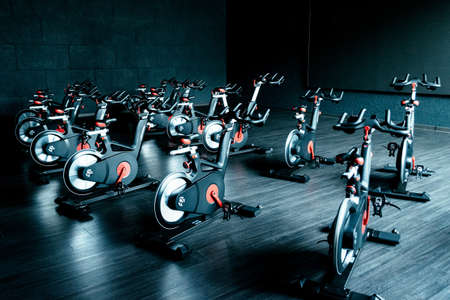 Gym cycling room with many exercise equipment