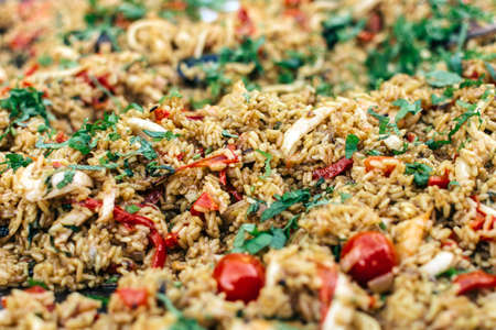 Dish of rice, herbs and vegetables close upの写真素材