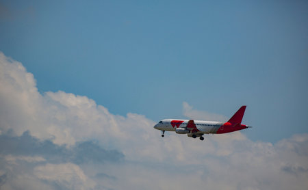 A passenger liner against the background of clouds at the moment of descent