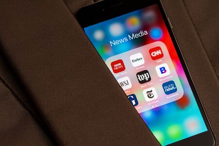 Tallinn / Estonia - September 18, 2019: Black Apple iPhone with icons of News media: BBC News, Forbes, CNN, WSJ, WP, Bloomberg, Guardian, NY Times and Euronews applications on screen. News media icons.のeditorial素材