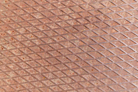 An old steel sheet with a pattern of rhombuses, founded in abandoned house