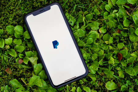 Tallinn / Estonia - September 28, 2020: Black iphone with logo of PayPal application on the screen....