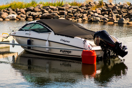 Lohusalu, Estonia - July 11, 2022. The powerboat Flipper 640 ST moored in a quiet harbor of the Baltic Sea near the capital of Estoniaのeditorial素材
