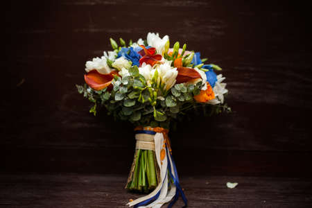 Wedding bridal bouque on the wooden benchの写真素材