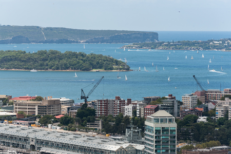 Sydney harbor with ships and yachts and adjacent bulidings from heightの写真素材