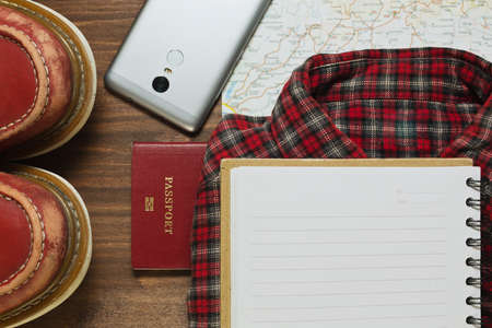 Some travel stuff on the wooden floor shooted in flat view styleの写真素材