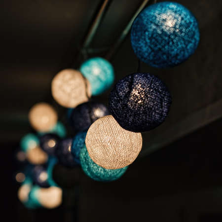 Decorations garland painted in blue in-between tints square frame