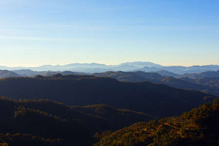 Mountains range in South-Eastern Asia in the evening sunlightの写真素材