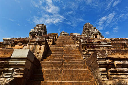 SIEM REAP, CAMBODIA - DECEMBER 29, 2016: Ascent to the top of hinduism temple in Angkor ancient complexのeditorial素材