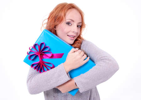 Woman holding gift box on white background
