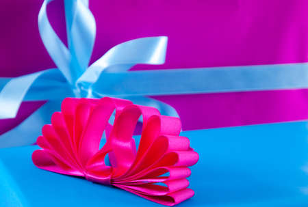 Christmas gifts , blue and purple boxes with stylish ribbonsの写真素材