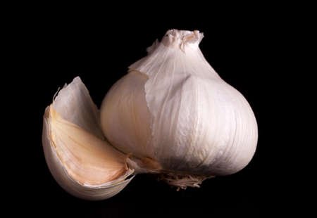 garlic isolated on black backgroundの写真素材