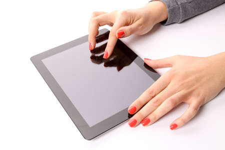 Female hands typing on tablet