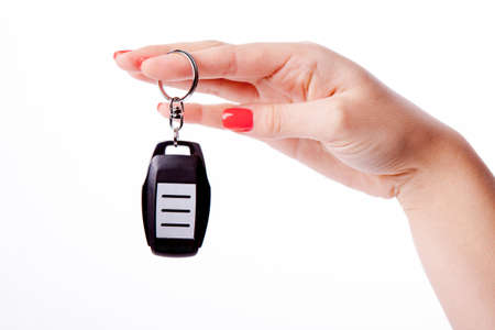 Beautiful woman hand holding remote control isolated on white background