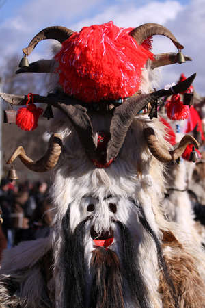 Bulgaria - jan 31, 2015: Man in traditional masquerade costume is seen at the the International Festival of the Masquerade Games "Surva" in Pernik, Bulgaria. Photo taken on: January 31th, 2015のeditorial素材