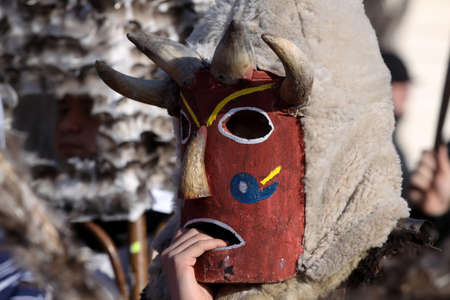 Bulgaria - jan 31, 2015: Man in traditional masquerade costume is seen at the the International Festival of the Masquerade Games "Surva" in Pernik, Bulgaria. Photo taken on: January 31th, 2015のeditorial素材